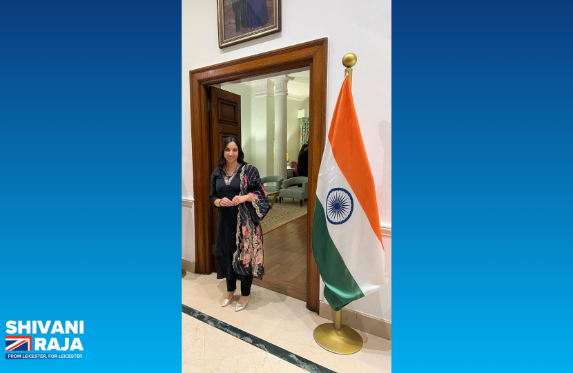 Shivani Raja MP stood with an Indian flag.